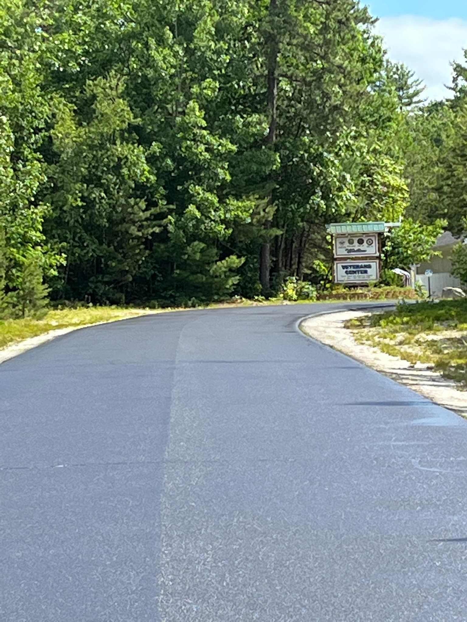 Two-car garage driveway freshly sealed, staked off with orange barrier tape